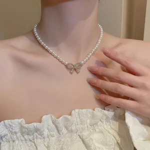 French vintage pearl necklace with a sparkling rhinestone bow pendant for women
