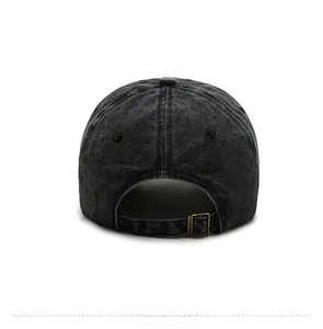 Close-up of vintage washed denim baseball cap with an adjustable metal strap buckle