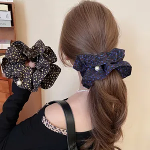 Floral oversized scrunchies with white pearl beads and elegant polka dot fabric patterns