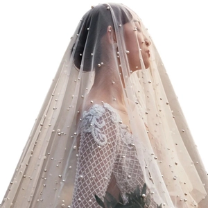 Elegant white bridal wedding veil with pearl accents in a French vintage style