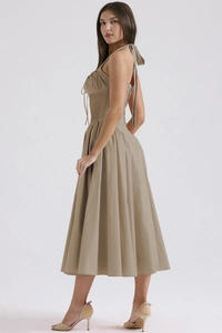 Detail of summer halter dress featuring thin neck ties and cinched waistline