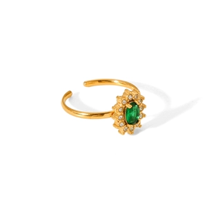 Detail of gold-plated open ring featuring a green oval zircon in a sunburst setting