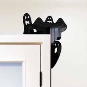 Close-up of black acrylic ghost corner decor with mirror effect for Halloween door frame
