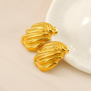 Golden 18K stainless steel earrings with irregular pleated wave texture on shell background