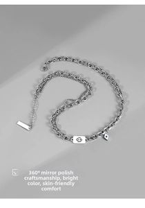 Detail of silver double chain necklace with Cancer sign pendant and 360-degree mirror polish