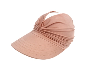 Detailed view of pink knitted sun visor with pleated texture and elastic fabric