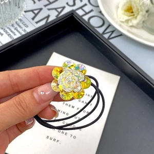 Elegant flower-shaped K9 crystal hair tie with yellow stones and durable black elastic bands