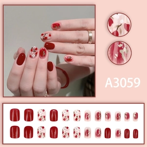 Short press-on nails set with elegant red tulip patterns and golden foil accents