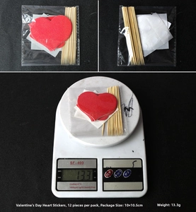 Detailed view of 12pcs red heart cake toppers with packaging and weight specifications