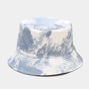 Close-up of the blue and white tie-dye fabric texture and fine stitching on a sun hat