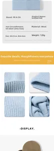 Detail view of light blue wool knit hat with size specs and material texture highlights