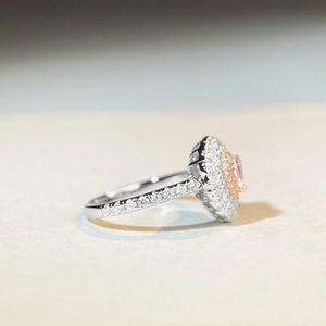 Elegant S925 silver ring featuring a pink oval gemstone surrounded by a halo of white stones