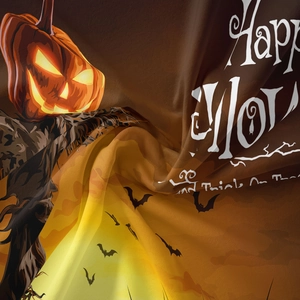 Detail of soft silk-like Halloween tapestry featuring orange pumpkin and bat patterns