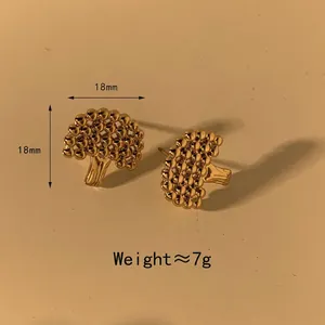 Modern gold tree-shaped stud earrings with spherical texture in organic design