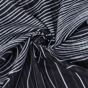 Macro detail of black and white striped mesh fabric with high-density texture and soft drape