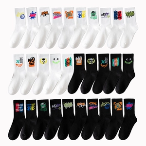 Collection of black and white crew sports socks with street style graffiti patterns