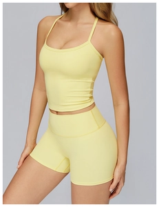 Detail of light yellow brushed yoga vest and high-waisted shorts with high elasticity
