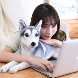 Close-up of realistic husky plush toy with soft grey fur and lifelike facial details