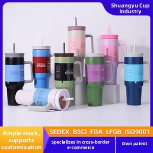 Detail of colorful 40oz stainless steel tumblers with handles and straws in various gradients