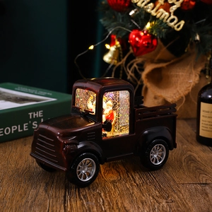 Detailed close-up of a vintage red truck snow globe with Santa and swirling glitter