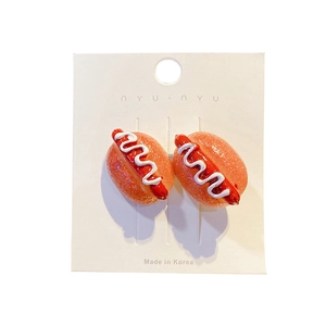 Pair of funny realistic hot dog hair clips on display card with Korean branding