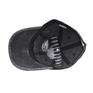 Detail view of cotton baseball cap interior with 100% cotton wash label and inner band