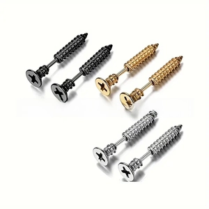 Detailed view of punk screw-shaped stud earrings in black, gold, and silver finishes