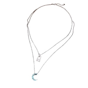 Collier double couche argenté avec pendentif lune en pierres bleues et breloque cadenas