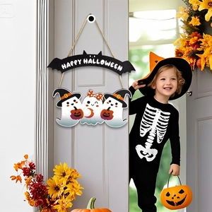 Halloween wooden door sign featuring ghosts and pumpkin hanging on a porch with festive decor