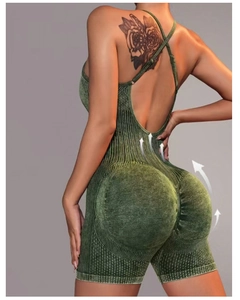 Detail showing the butt lift effect and rib-knit texture of the green yoga romper
