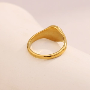 Minimalist 18K gold-plated stainless steel moon round ring on warm white pedestal