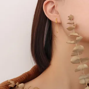Minimalist gold-plated stainless steel tassel chain earrings worn on model for a trendy look