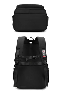 Detail view of adjustable shoulder straps with chest buckle and luggage strap on black backpack