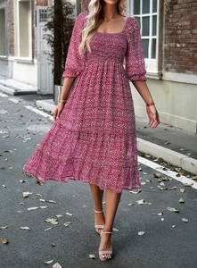 Detail of red floral midi dress featuring smocked bodice and square neckline design
