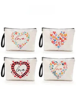 Detail showing four different heart pattern designs on canvas makeup bags with zippers