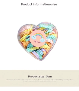 Macro detail of high-elasticity colorful hair ties set in a heart-shaped transparent box
