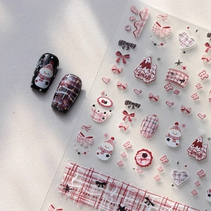 Christmas nail art stickers with snowman, red bow and heart patterns on matte finish