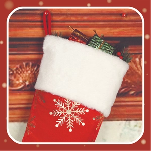 Detail of red velvet Christmas stocking with gold snowflake and white faux fur trim