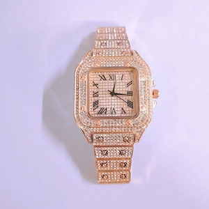 Detail of luxury rose gold square watch with full diamond setting and Roman numerals