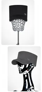 Detail of military flat top cap with Sports Style metal badge and stitched visor brim