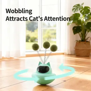 Interactive tumbler cat toy with suction cup base and spring ball in mint green color