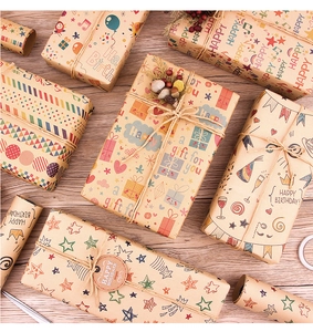 Flat lay of musical note kraft gift wrap boxes with twine and tags on wood
