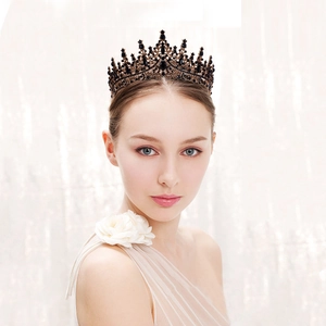 Macro detail of luxury baroque bridal crown with black crystals and vintage gold base