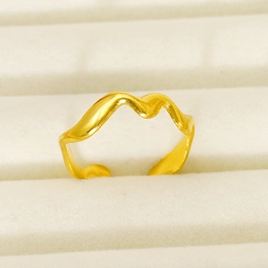 Elegant wavy gold plated ring with a minimalist irregular design shown on jewelry display