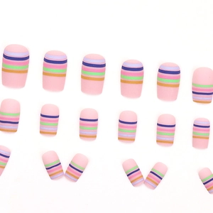 Matte rainbow stripe press-on nails with multi-color horizontal lines on light pink base