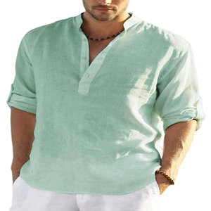 Close-up of mint green linen shirt with three-button Henry collar and fabric texture