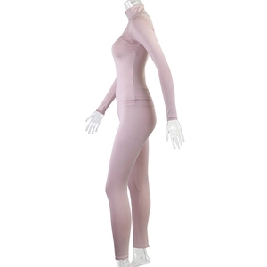 Side view of mauve two-piece fitness set with stand collar zip jacket and high waist leggings