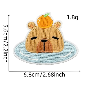 Detail view of a cute capybara embroidery patch with dimensions 5.6cm by 6.8cm
