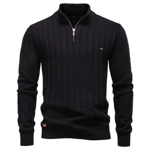 Detailed view of striped knit texture and high-quality metal zipper on black sweater