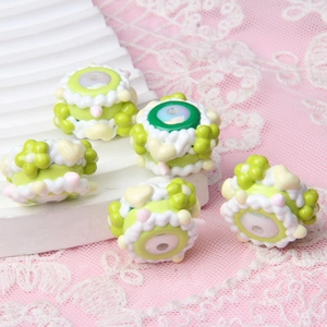 Macro shot of handcrafted acrylic floral beads for DIY jewelry and phone charms